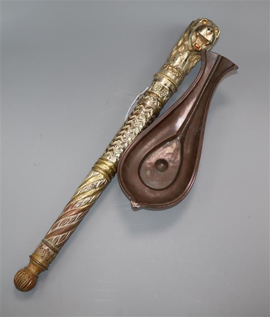 An Indian silvered and gilded copper processional staff and a copper libation cup longest 56cm